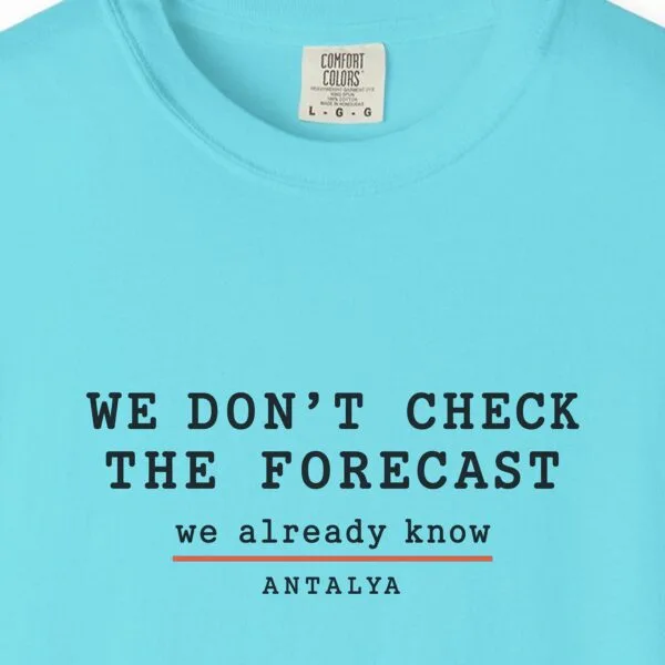 we-dont-check-the-forecast-day-tee-lagoon-blue-chest We Don't Check the Forecast Day Tee